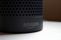 The Amazon logo on an Amazon Echo.