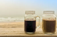Coffee mugs by the beach
