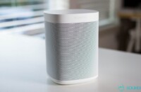 A Sonos One speaker on a table.
