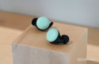 Google Pixel Buds 2 in Quite Mint on a wooden block