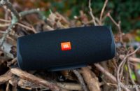 Pictured is the JBL Charge 4 in a wet outdoor situation to show off its IPX7 rating.