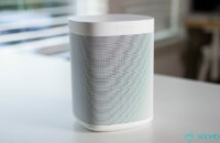 Sonos One Alexa speaker image on white desk.