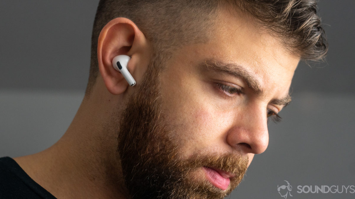 A picture of a man wearing the Apple AirPods Pro noise-canceling true wireless earbuds.